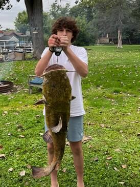 Lazy Lake Norman flathead catfish meets 10-year-old boy with a net