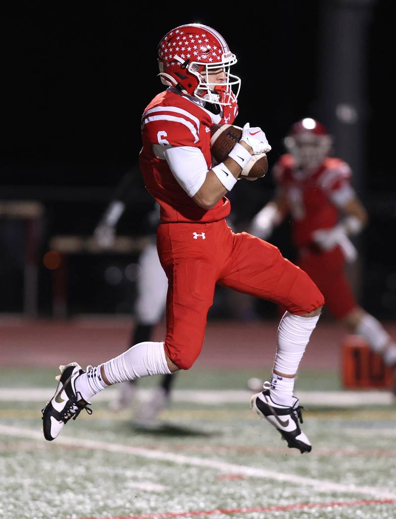 Naperville Central's Christopher Bern catches a touchdown pass during their game against DeKalb Friday, Oct. 6, 2023, at Naperville Central High School.