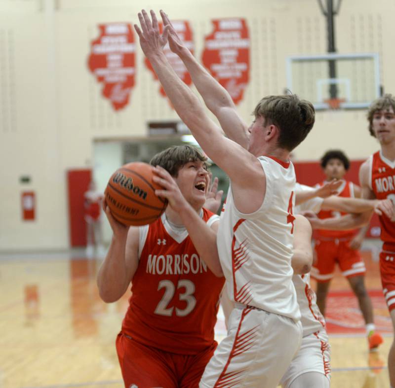 Morrison's Carson Strating (23) looks to shoot against Oregon's Jameson Caposey (4) during 2A regional action on Monday, Feb. 19, 2024 at the Blackhawk Center in Oregon. The Mustangs downed the Hawks 59-52.