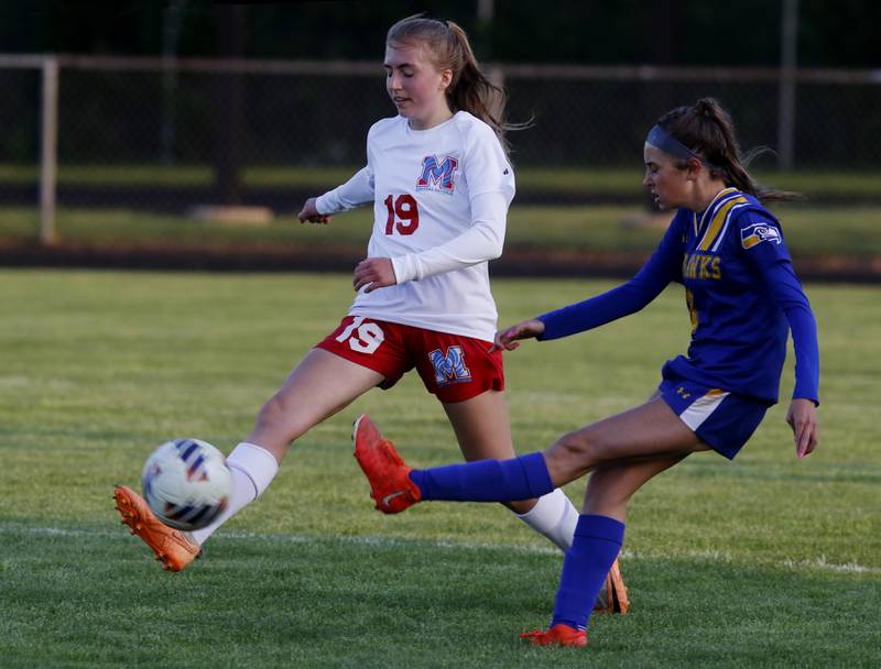 Marian Central'a Zeda Deaver tries to block the kick of Johnsburg's Charlie Eastland during the IHSA Class 1A Marengo Regional championship soccer match on Tuesday, May 14, 2024, at Marengo High School.