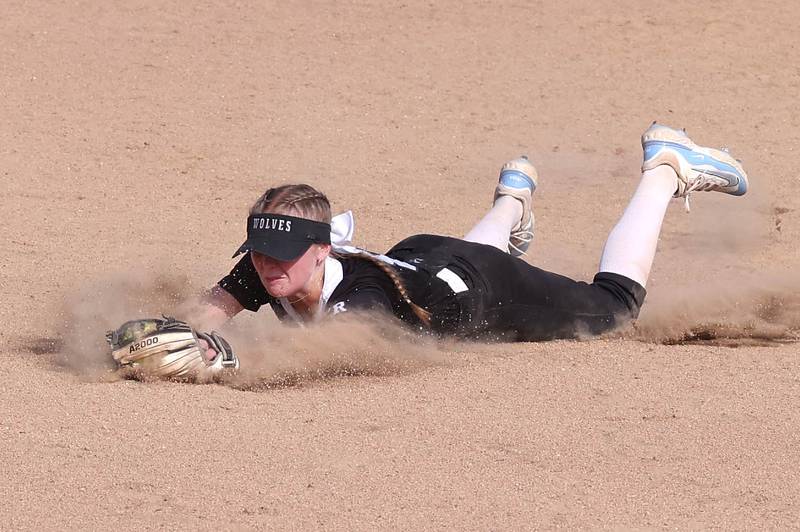 Prairie Ridge's Adysen Kiddy makes a diving stop during their Class 3A sectional final against Sycamore Friday, May 31, 2024, at Sycamore High School.