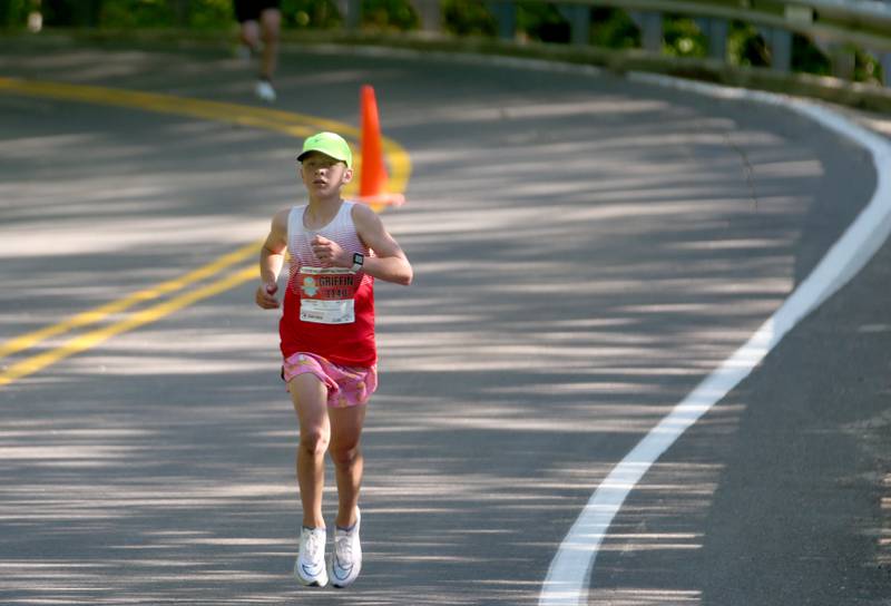 Griffin Poterek 14, of Geneva, runs during the Starved Rock Marathon and Half Marathon on Saturday, May 11, 2024 at Starved Rock State Park.