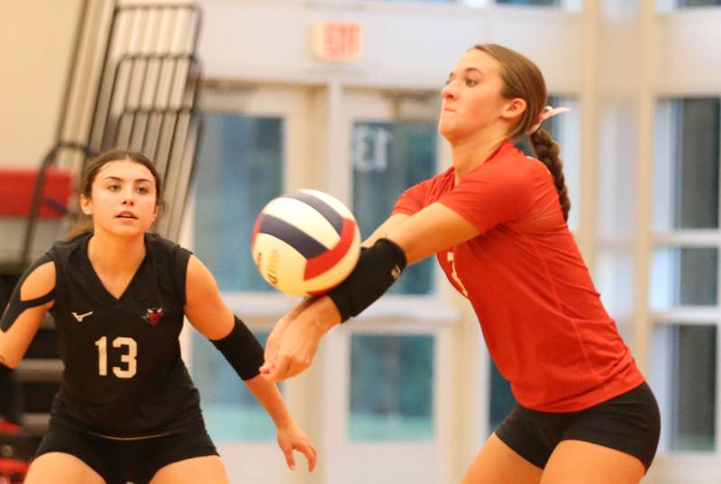 Hall's Kaitlyn Coutts returns a serve from Princeton as teammate Ellie Brooks watches on Tuesday, Sept. 17, 2024 at Hall High School.