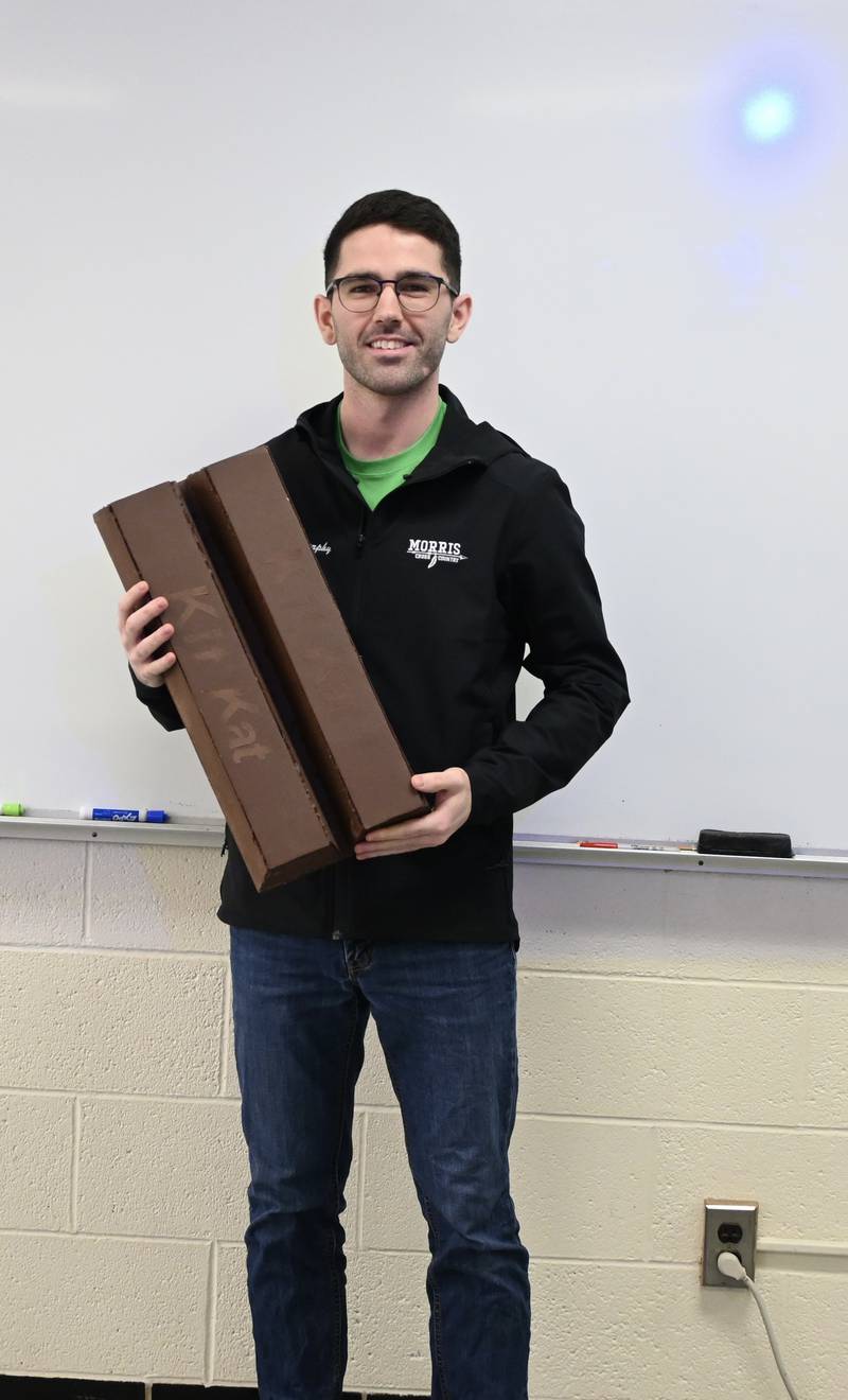 High School math teacher Nick Murphy holds a Kit-Kat bar one of his students made as a math project. His students learn how to take the dimensions, the measurements, and then scale them up or down to create a piece of artwork out of whatever material they choose.