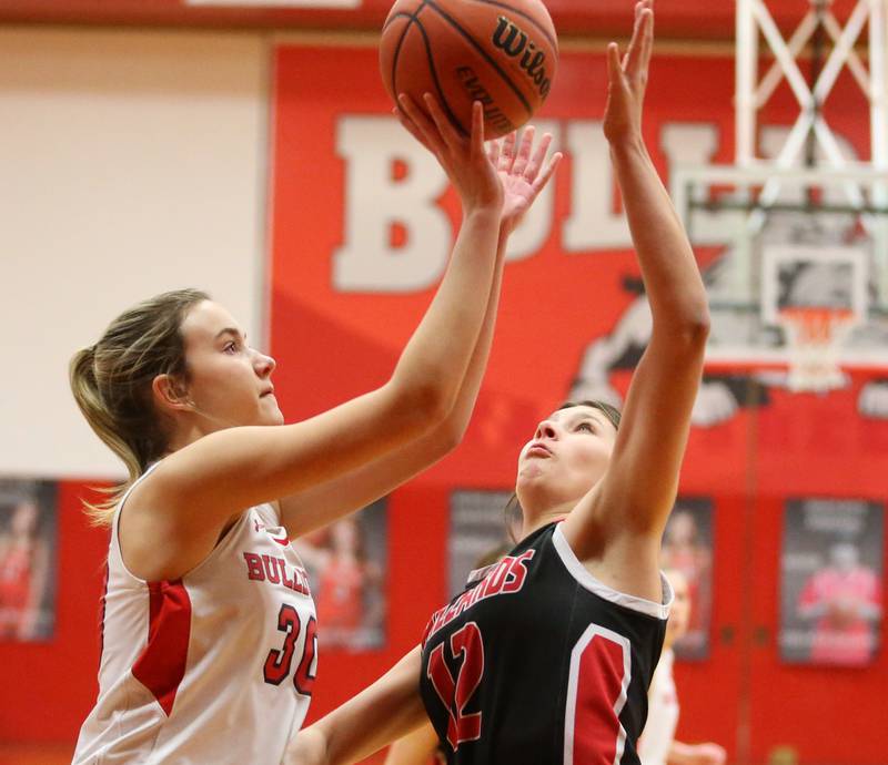 Streator's Marisa Vickers (left) drives to the hoop as Henry-Senachwine's Kaitlyn Anderson (right) defends on Wednesday, Jan,. 4, 2023 at Streator High School.