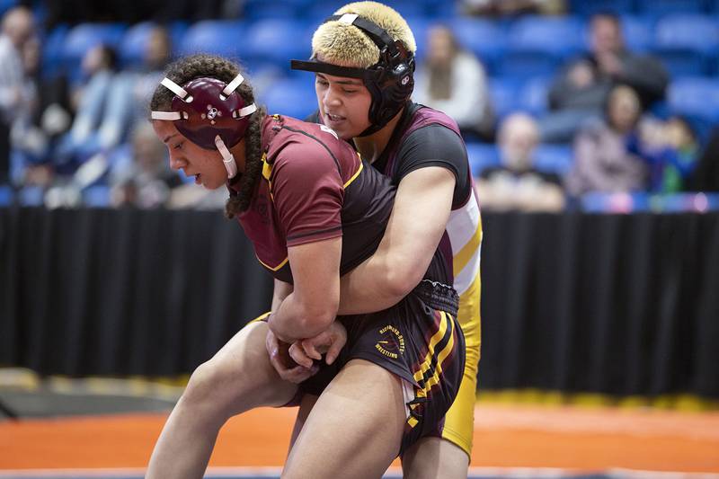 Valeria Rodriguez of Schaumberg holds Richmond-Burton’s Jasmine McCaskel in the 140 pound third place match at the IHSA girls state wrestling championship Saturday, Feb. 25, 2023.