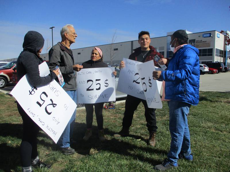 Amazon workers gather outside the Channahon warehouse for a demonstration for higher wages on Friday, Oct. 14, 2022.