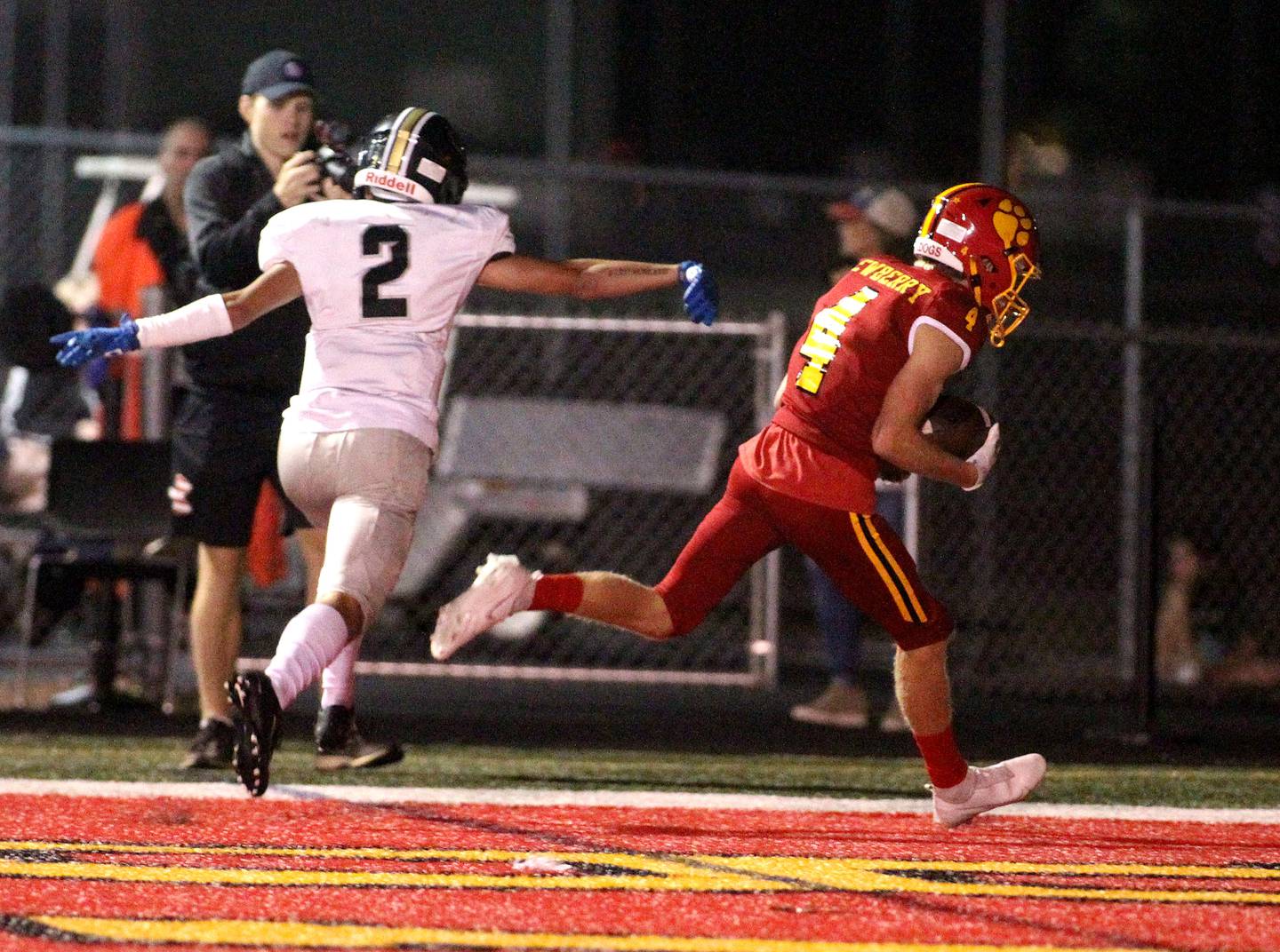 Batavia's Eric Newberry (4) scores a touchdown during a home game against Glenbard North on Friday, Sept. 24, 2021.