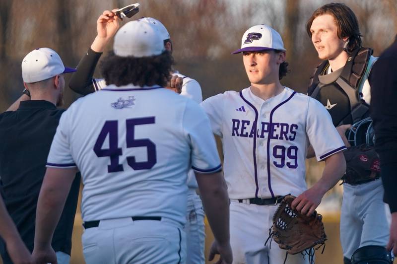 Plano's Kaden Aguirre (99) is greeted by team mates after defeating Marengo during a baseball game at Plano High School on Monday, April 8, 2024.