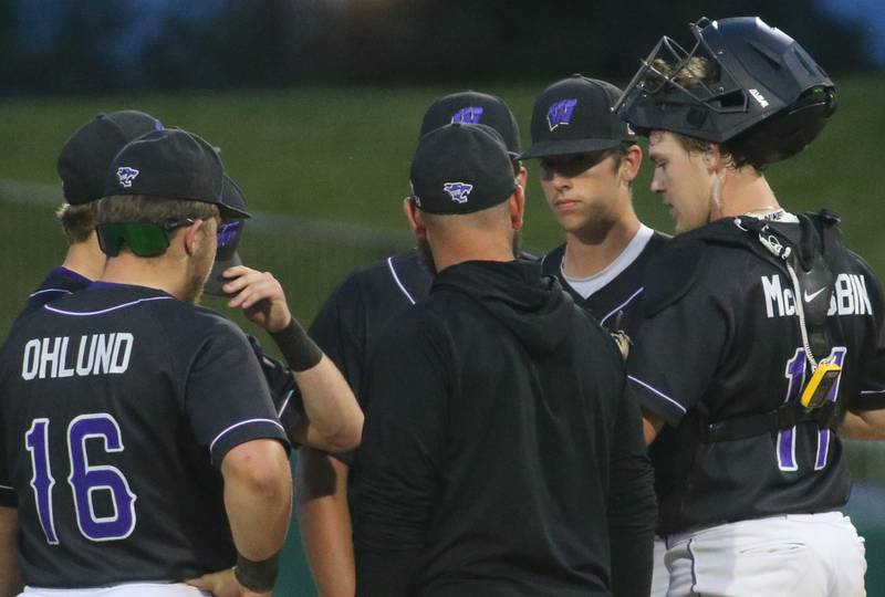 Members of the Wilmington baseball team meet on the mound during the Class 2A semifinal game on Friday, May 31, 2024 at Dozer Park in Peoria.