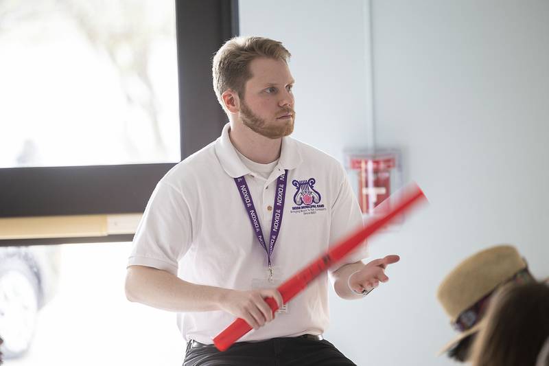 Jefferson School music teacher Nolan Lewis leads his class Friday, April 21, 2023. Lewis requested money from the Dixon Schools Foundation go to purchase the plastic instruments. Last year the foundation purchased ukeleles for the music program.