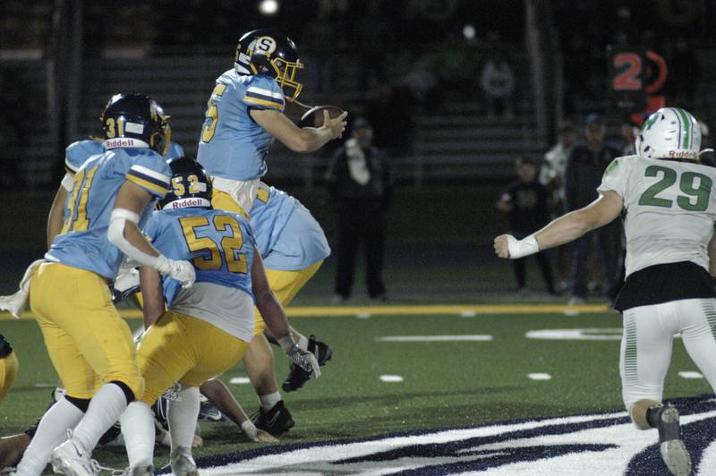 Sterling Quarterback Drew Nettleton scrambles with the football.Niles North traveled to Sterling High School to play the Warirors on Sept. 6, 2024