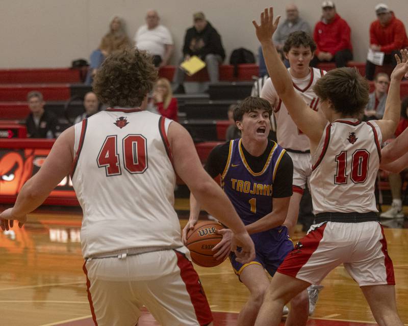 Cale Strouss of Mendota High School drives to the hoop through multiple Hall High School defenders during the IHSA 2A Regional Semifinal at Hall High School on February 19, 2024.