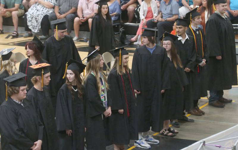 Putnam County High School graduates stand to be recognized during graduation on Sunday, May 19, 2024 at Putnam County High School.