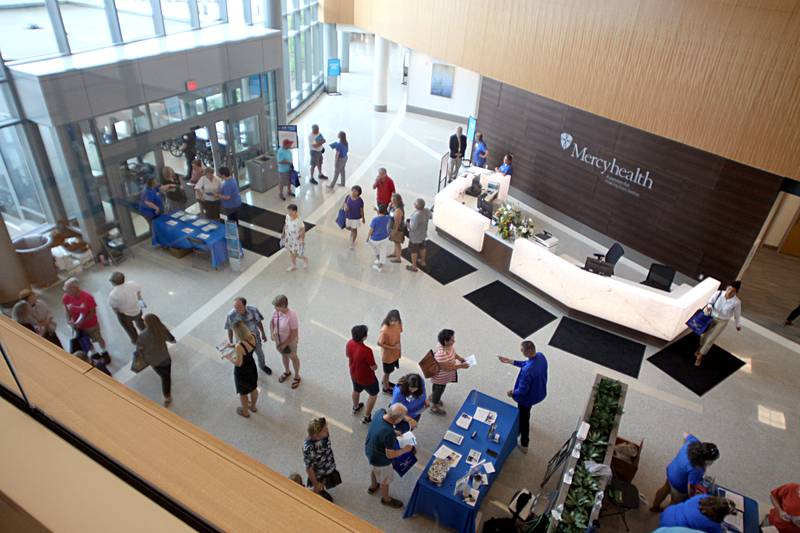 People crowd the main lobby during a public open house for the new Mercyhealth hospital in Crystal Lake on Saturday.