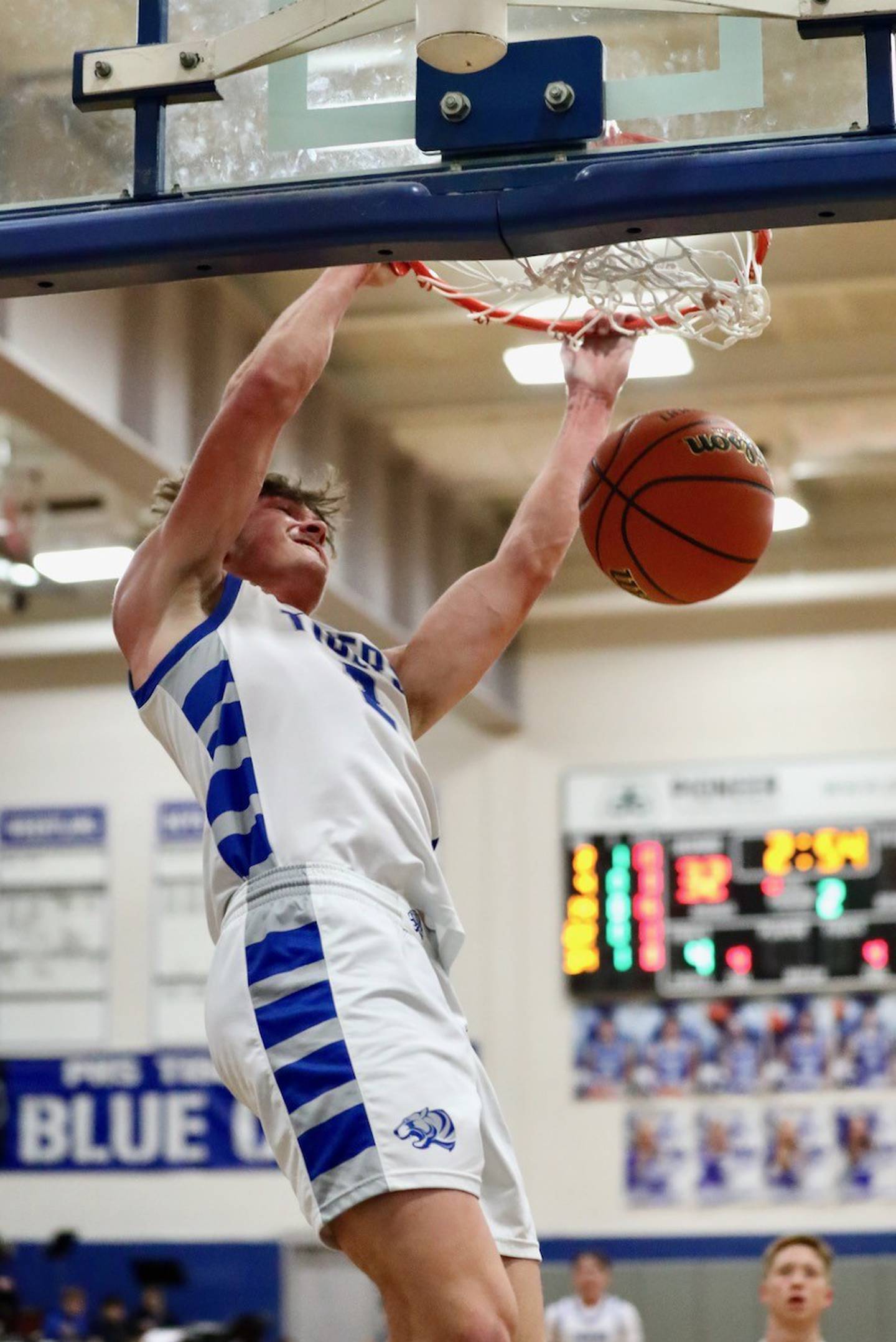 Princeton's Teegan Davis throws down a dunk against Newman Friday night at Prouty Gym. The Tigers won 80-32.