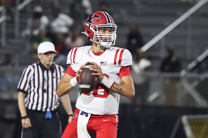 Yorkville’s Jack Beetham looks to pass against Joliet West on Friday, Sept. 13, 2024 in Joliet.