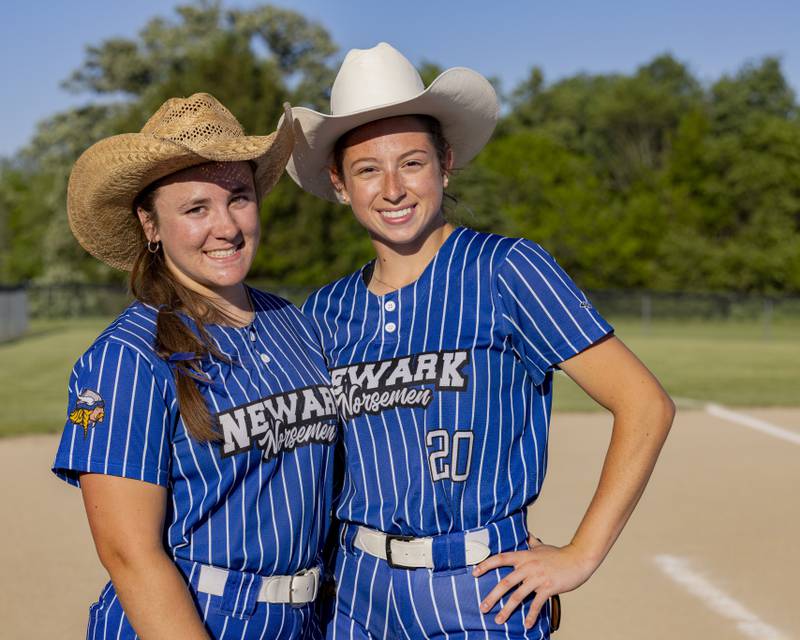 Danica Peshia (left) and Kodi Rizzo (right) pose after Newark's win over Grant Park in the semifinal game of the Class 1A Sectional Semifinal game at Woodland High School on May 22, 2024. The cowboy hats have become a postseason win tradition for the two girls.