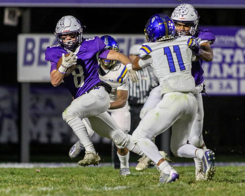 Wilmington's Kyle Farrell (8) runs behind the blocking of Braeden Anderson (1) during Class 2A semi-final playoff football game between Maroa-Forsyth and Wilmington in November 2023.