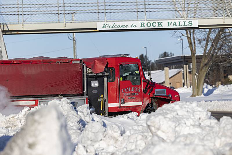 A Coleta truck leaves East Coloma-Nelson School Tuesday, Jan. 16, 2024 after having refilled with water.