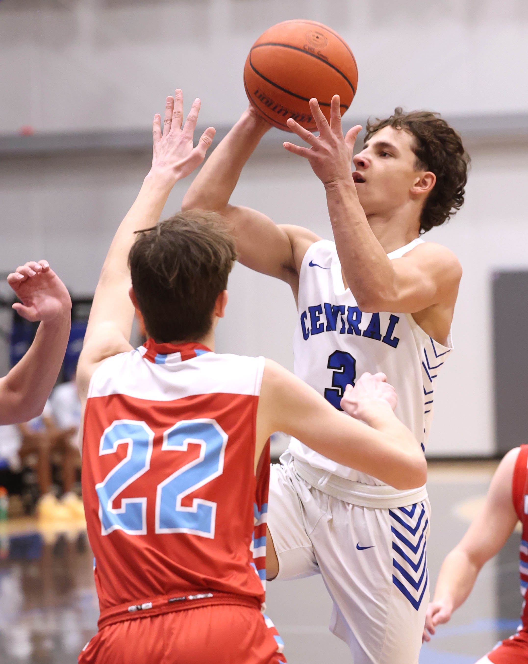 Burlington Central's LJ Kerr shoots over Marian Central's Derek Leitzen Monday, Jan. 15, 2023, during their game in the Burlington Central Martin Luther King Jr. boys basketball tournament.