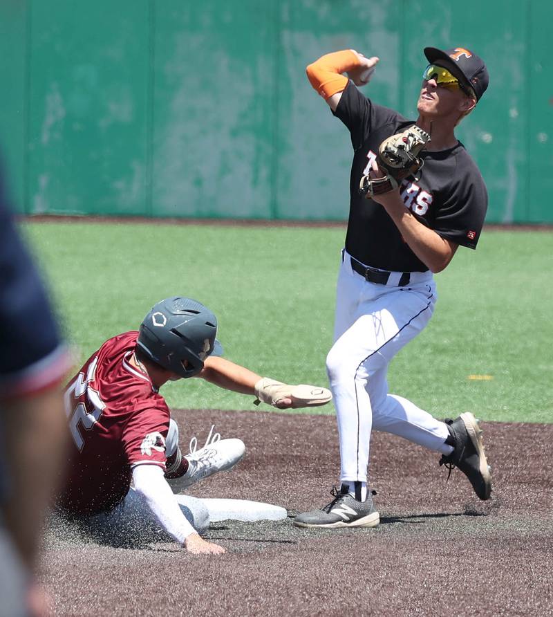 Crystal Lake Central's James Dreher tries to turn a double play as Morris' Brett Bounds tries to break it up during their Class 3A state semifinal game Friday, June 7, 2024, at Duly Health and Care Field in Joliet.