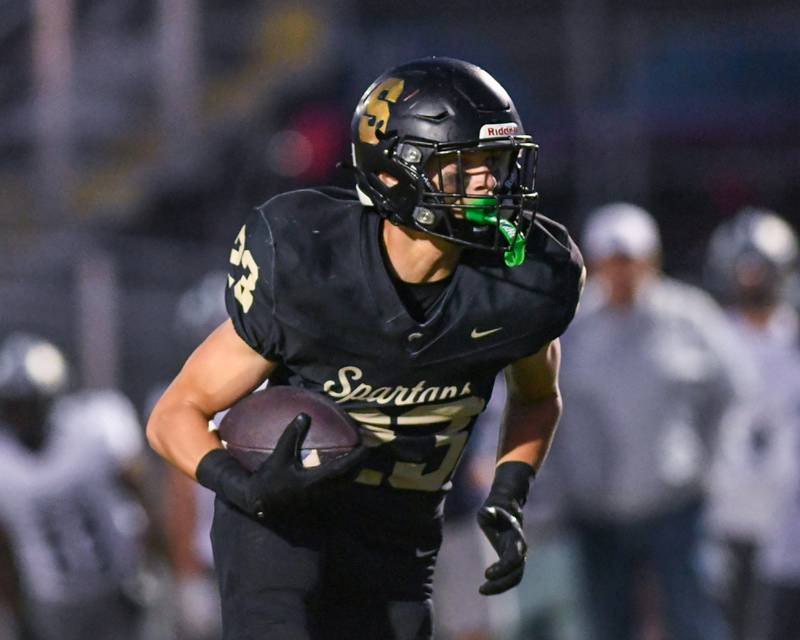 Sycamore's Dylan Hodges (23) runs the ball during the game on Friday Sep. 6, 2024, while taking on Oswego East.