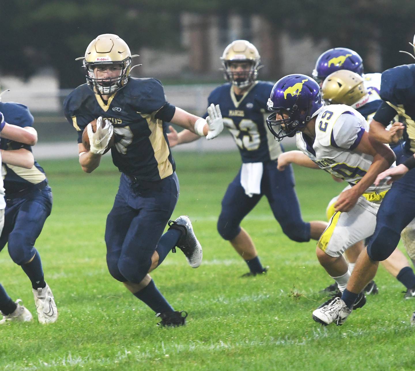 Polo's Brock Soltow avoids Orangeville defenders during 8-man football action in Polo on Saturday, Sept. 3.