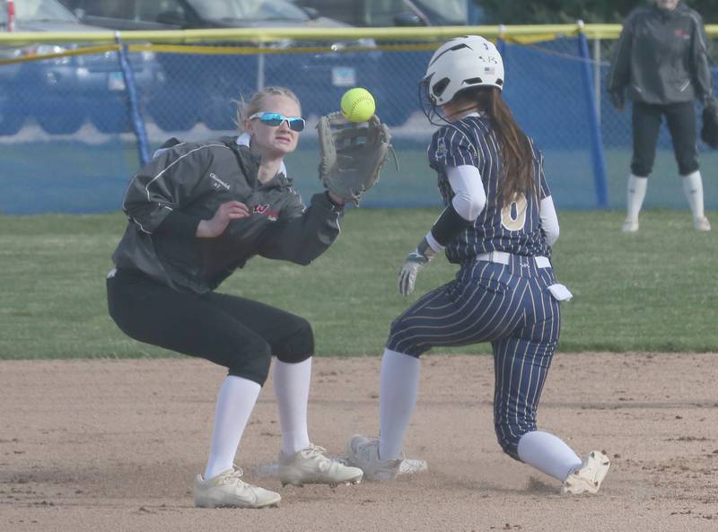 Woodland/Flanagan-Cornell's short stop Olivia Chrismarick makes a late catch at second base as Marquette's Maisie Lyons reaches second base on Wednesday, March 27, 2024 in Ottawa.
