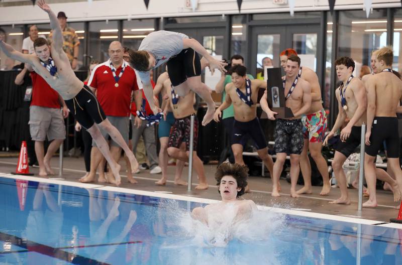 Hinsdale Central celebrates after winning the IHSA Boys state swim finals Saturday February 25, 2023 in Westmont.