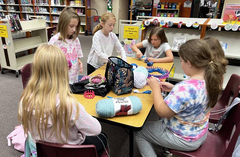 Students in the Lakewood Creek Knitting Club have the option to learn finger knitting, loom knitting or knitting with needles.