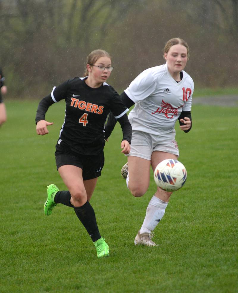 Oregon's Shaylee Davis (10) and Byron's Alya Roschi (4) chase the ball on Thursday, April 18, 2024 at Byron High School.
