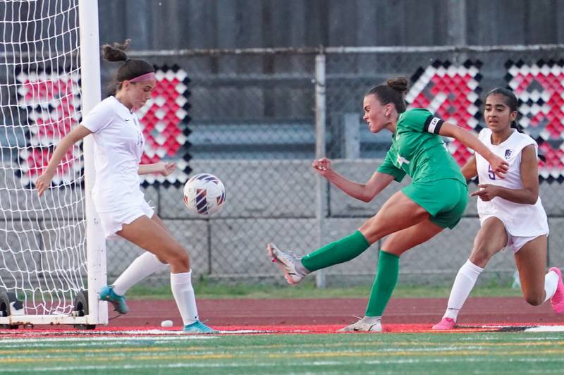 York’s Michaela Quinn (14) shoots the ball against Downers Grove North during a Class 3A Hinsdale Central Sectional semifinal soccer match at Hinsdale Central High School in Hinsdale on Tuesday, May 21, 2024.