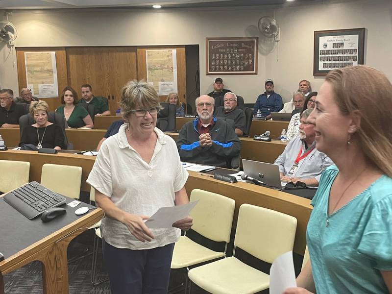 Gelinda Heller (left) smiles after being sworn in Monday, June 12, 2023, to the La Salle County Board by County Clerk Jennifer Ebner (right). Heller will complete the unexpired term of the late Joe Witczak.