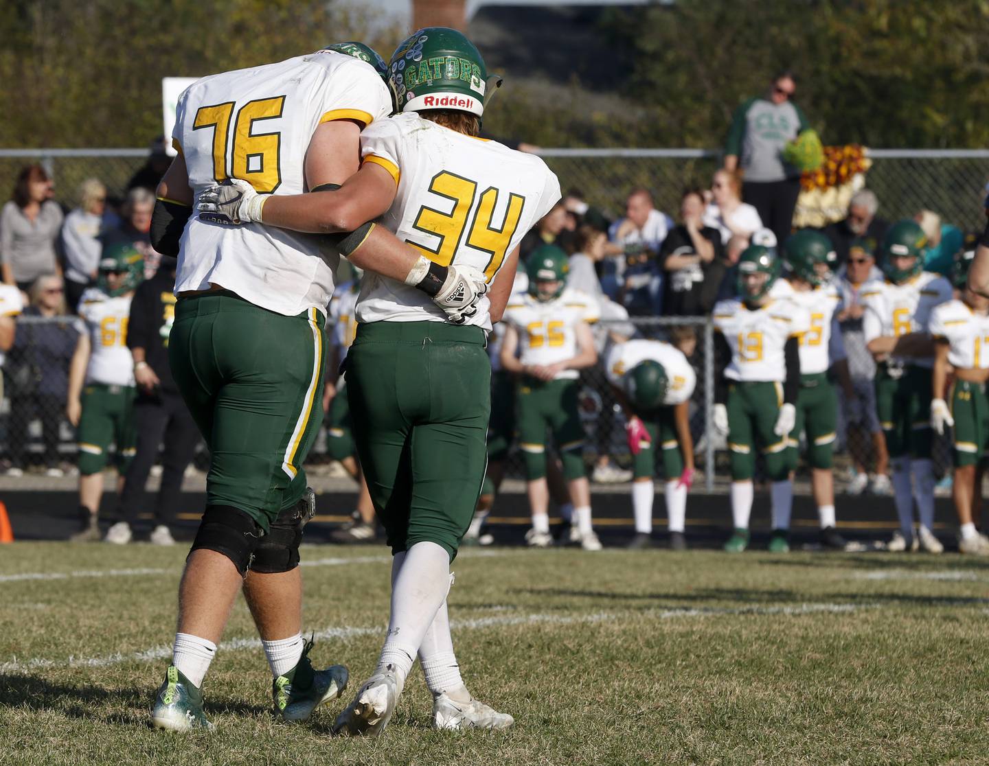 Crystal Lake South's Nate Comperea and \his teammate, Crystal Lake South's Daniel Zebrowski walk of the filed in the final minute of their loss to Prairie Ridge in a IHSA Class 6A first round playoff football game Saturday, Oct. 29, 2022, at Prairie Ridge High School in Crystal Lake.