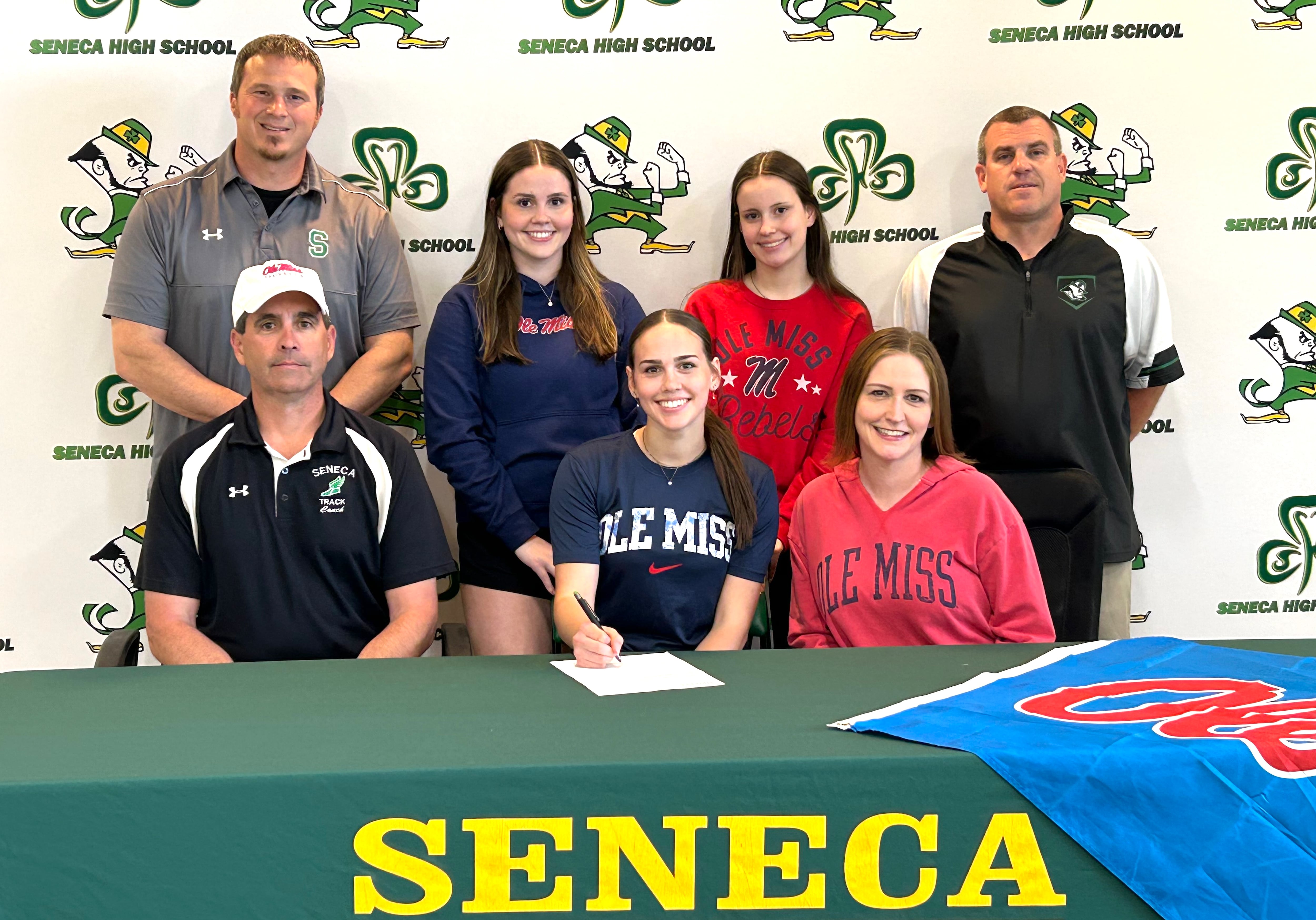 Seneca’s Teagan Johnson has signed to continue her education at the University of Mississippi, aka Ole Miss, in University, Miss., and her track and field career at the NCAA Division I level with the Rebels. Johnson was a sectional champion and state qualifying pole vaulter for the Fighting Irish, earning a spot on the 2024 Times All-Area Girls Track and Field Honor Roll. Pictured (from the left) are: in front – Jim Johnson, Teagan Johnson and Karissa Johnson; in back – Seneca track and field coach Terry Maxwell, Riley Johnson, Talia Johnson, and Seneca AD Ted O’Boyle.