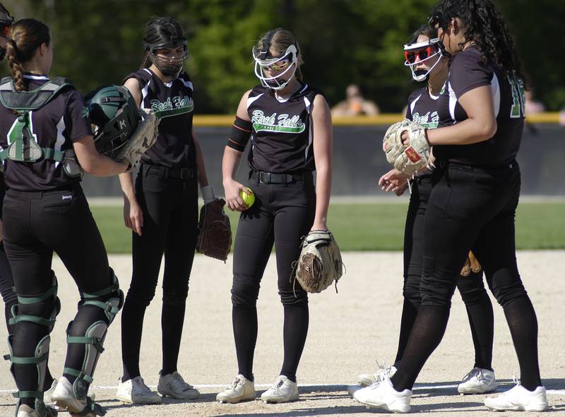 Rock Falls starting pitcher Zoey Silva talks with her infielders on Monday, May 6, 2024 in Rock Falls.