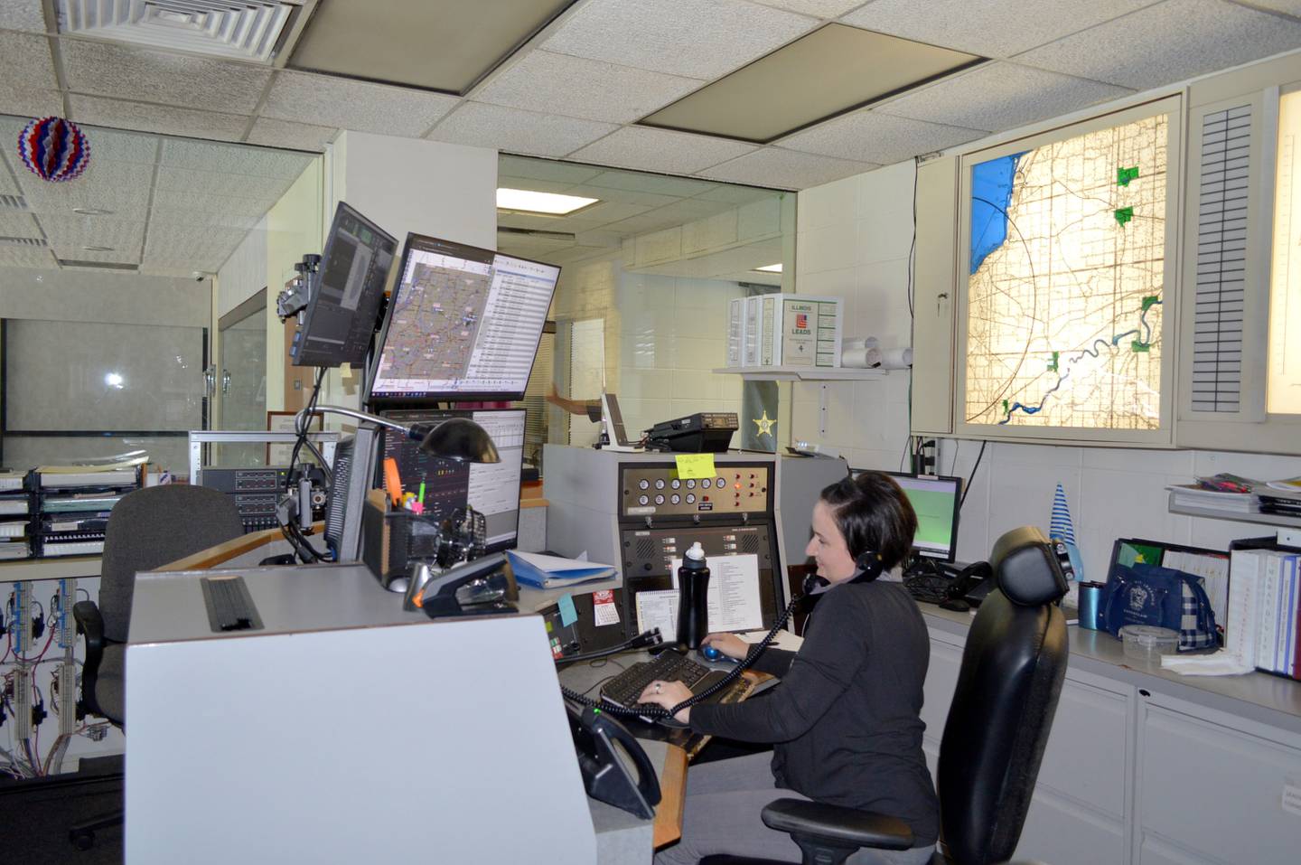 Whiteside County 911 dispatcher Danielle Robbins poses at her station in the Morrison dispatch center from which she responds to emergency calls on June 27, 2024. In September, Whiteside County dispatch will consolidate its Sterling and Morrison centers to a new dispatch center in Morrison.