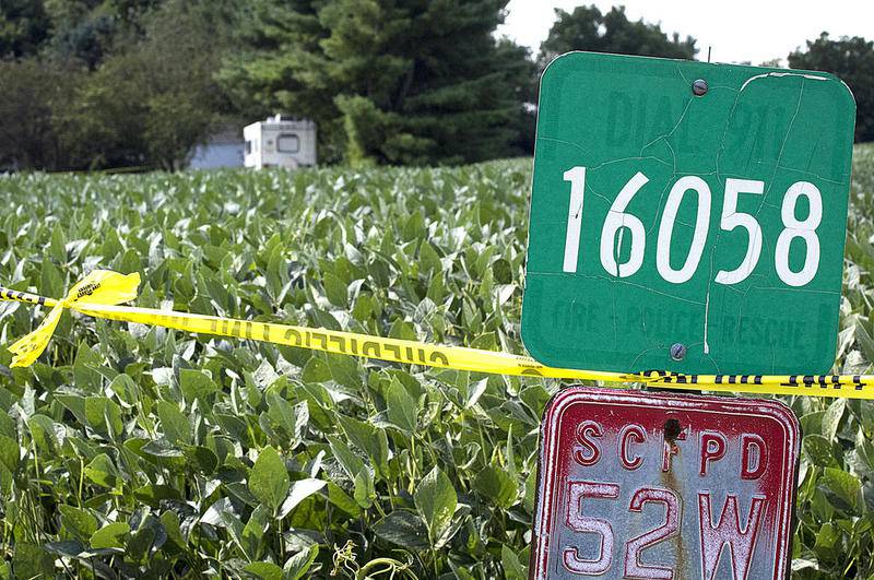 Crime scene tape closes off the property at 16058 Old State Road on August 16, 2016, in Sycamore. Patricia A. Wilson, 85, and her son, Robert J. Wilson, 64, were found murdered at the residence Aug. 14, 2016.