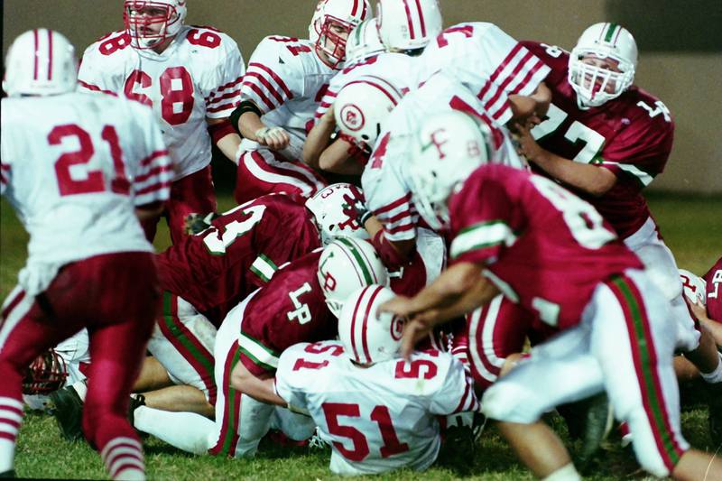 L-P and Ottawa play football in 1999. This was the 100th meeting between the two teams.