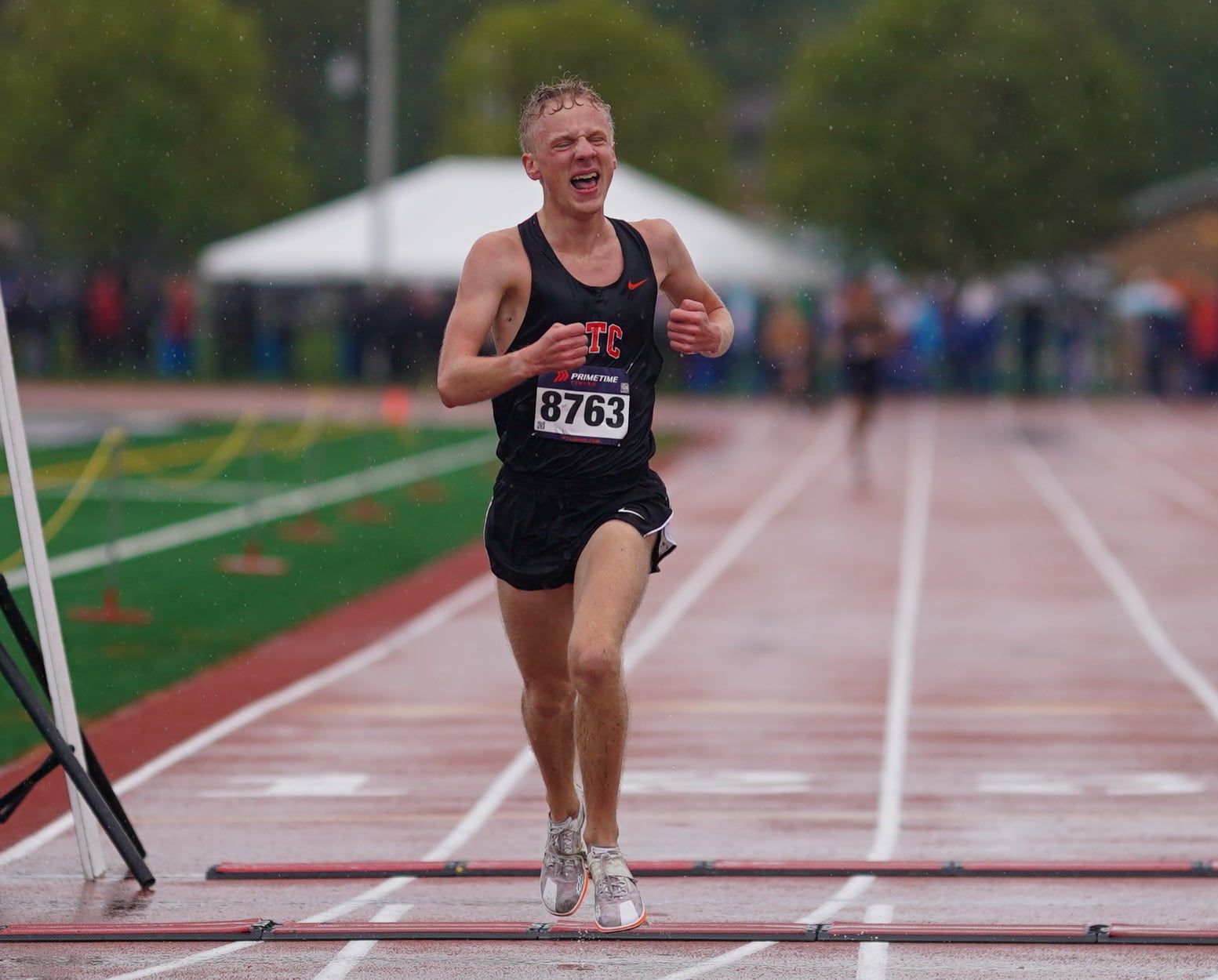 St. Charles East’s Jedidiah Wilson leads the pack early to finish first with a time of 15:11.9 during the DuKane Conference Cross Country Championships at Lake Park High School in Roselle on Saturday, Oct. 14, 2023.