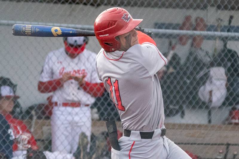 Yorkville's Sebastian Westphal (11) singles driving in two runs against West Aurora during a baseball game at West Aurora High School on Monday, April 24, 2023.