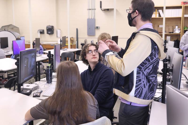 Educator Gregory D'Addario, who teaches TV production and english at Sycamore High School, goes over some ideas for a movie scene recreation with students in his class Wednesday, March 1, 2023, at the school.