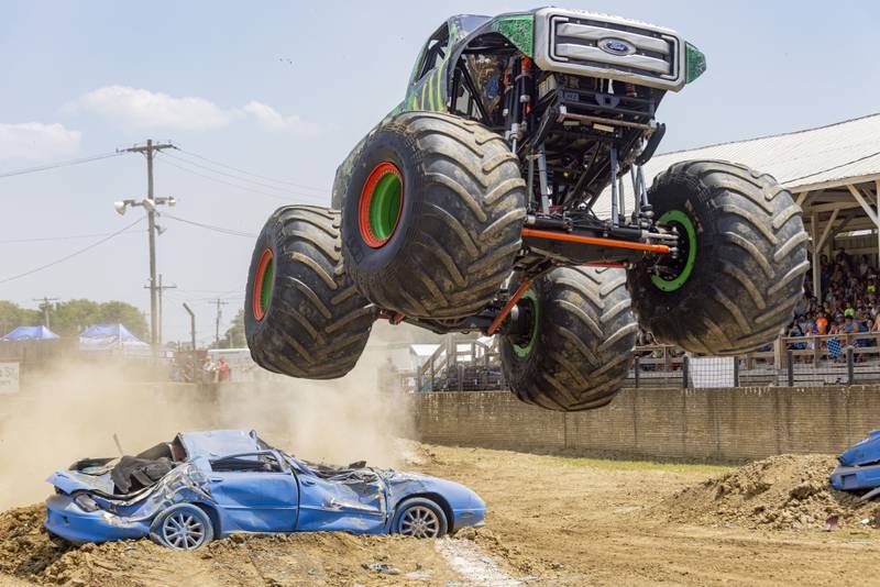Brad Shippert, driver of the truck "Against The Grain" leaps over a car during the Overdrive Monster Truck Tour that took place at the Bureau County Fairgrounds on June 3, 2023.