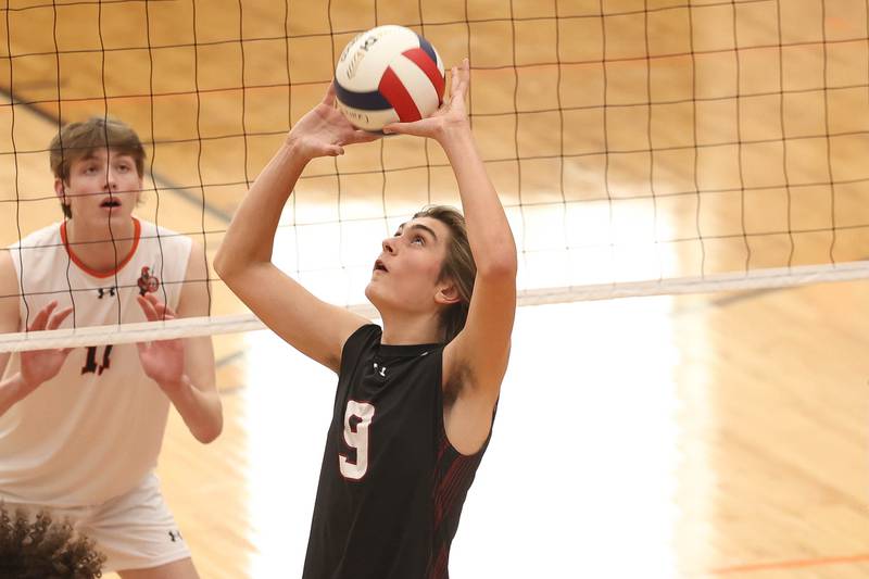 Plainfield North’s Easton Isaacson sets the ball against Lincoln-Way West on Monday, March 18, 2024 in New Lenox.