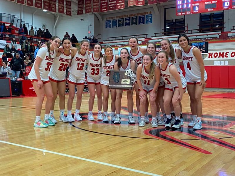 The Benet girls basketball team poses with the supersectional plaque after beating Kenwood 47-46 at Monday's Class 4A Hinsdale Central Supersectional.