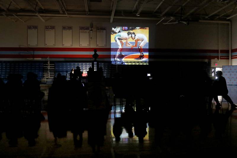 A photo montage is shown as Marina Central honors their wrestlers that brought home the IHSA Class 1A Dual Team State Championship title on Friday, March 8, 2024, during a celebration at the high school in Woodstock.