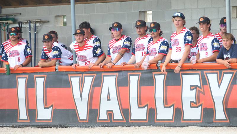Members of the Illinois Valley Pistol Shrimp baseball team watch from the dugout on Wednesday, July 3, 2024 in Schweickert Stadium at Veterans Park in Peru. The Pistol Shrimp held their annual Salute to Veterans honoring local members who served in the military.