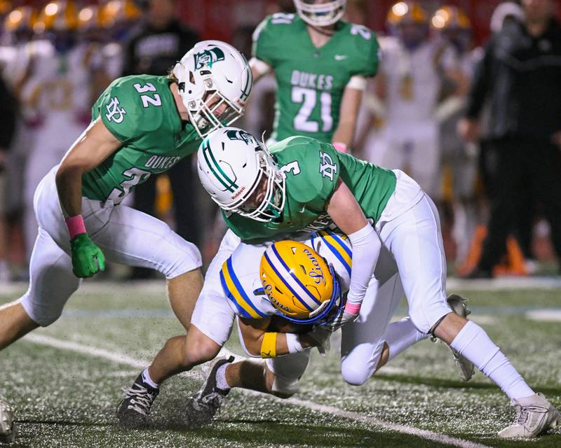 York High School Aidan Link (3) stops Lyons Township's Mack Long (1) during the game on Friday Oct. 18, 2024, held at York High School in Elmhurst.