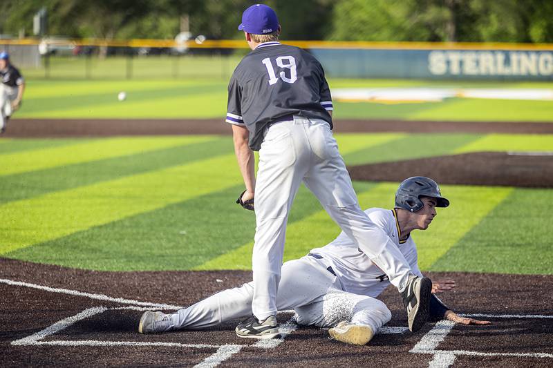Sterling’s Mason Smithee steals home on a wild pitch against Rochelle Monday, May 20, 2024 the class 3A regional quarterfinal.Monday, May 20, 2024.